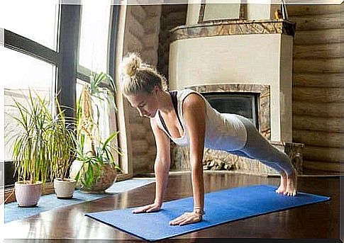 Woman performing push-ups at home