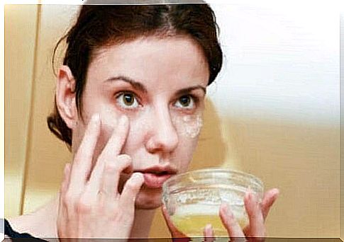 Woman applying a facial treatment