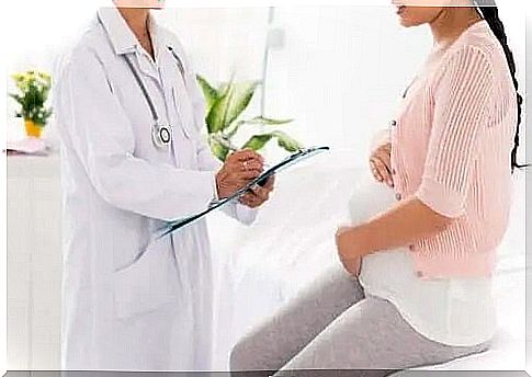 Doctor explaining the benefits of prenatal massage