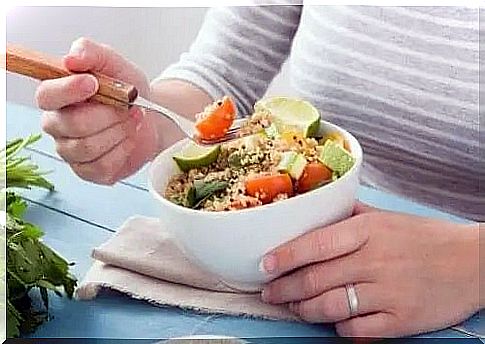 Woman eating a vegan dish