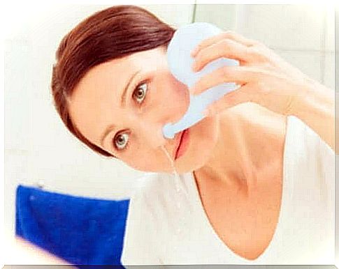 Woman performing a nasal irrigation