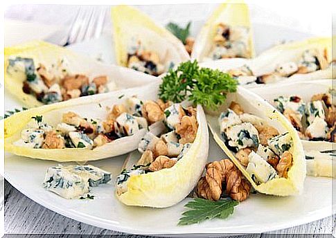 Tasty and healthy salad with endives and nuts