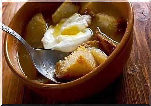 Bowl with soup and poached egg