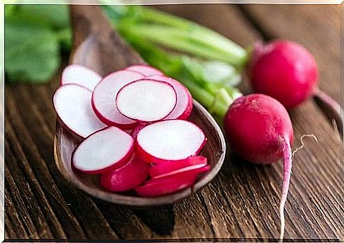 Wooden spoon with radish slices